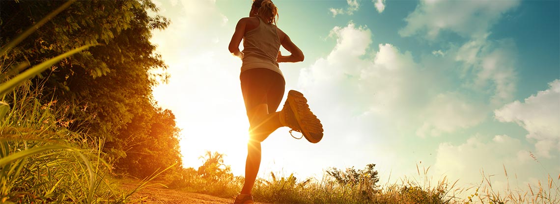 Woman running along a path